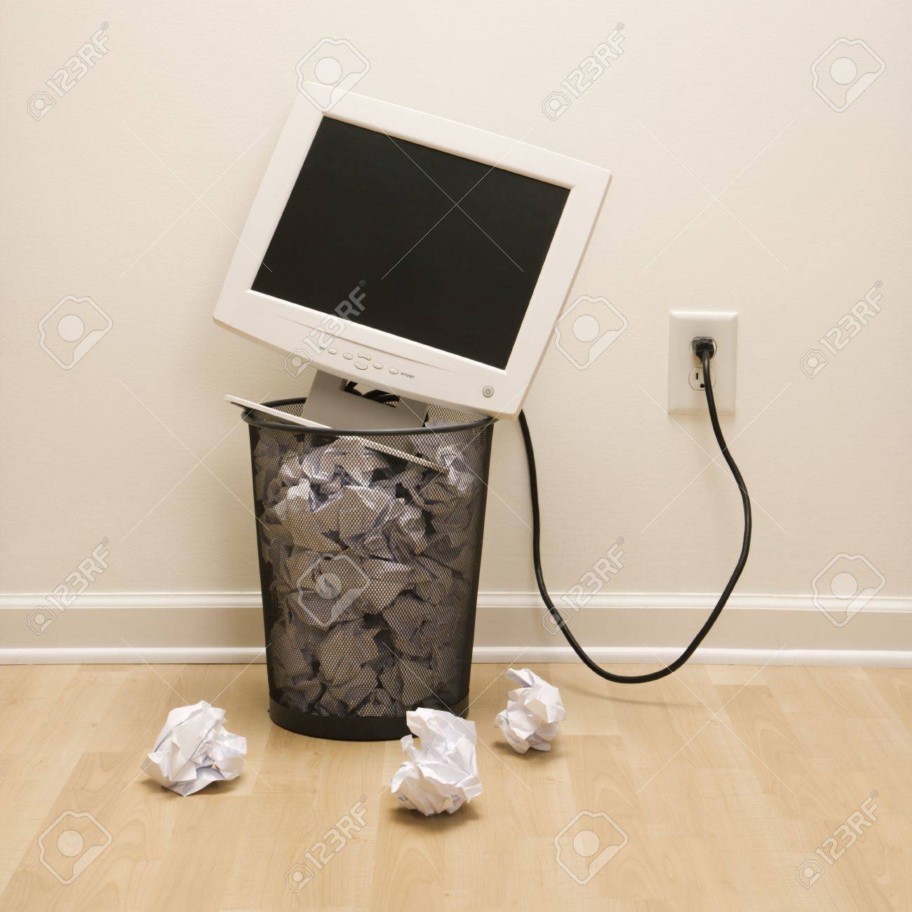 2190420-computer-monitor-in-trash-can-surrounded-by-crumpled-up-paper-.jpg