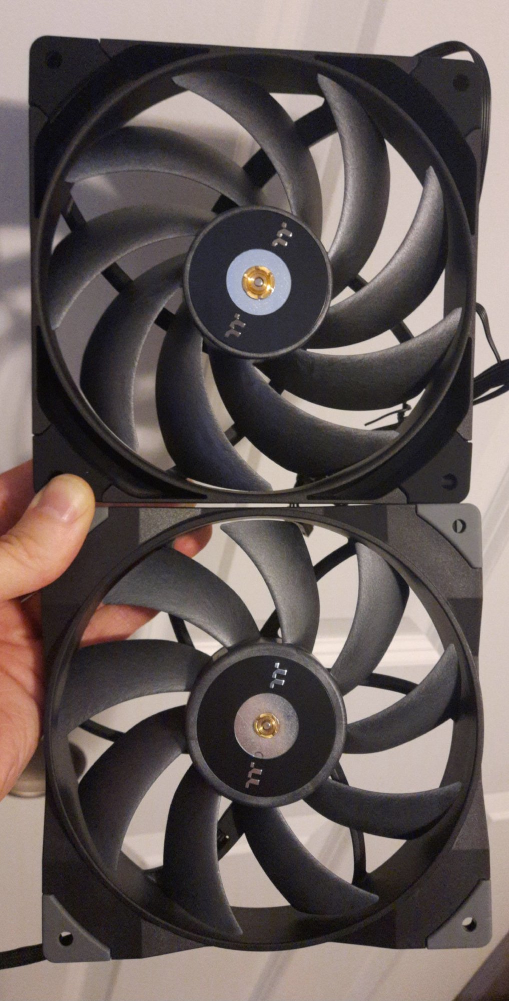 I got a pair of Thermaltake Toughfan 14 Pro, to replace the